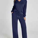 Damen Freizeitanzug mit Zipper-Pullover und weiter Hose