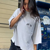 Oversized Damen T-Shirt in Grau mit kleinem Logo-Print