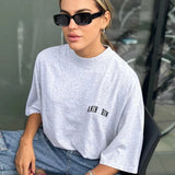 Oversized Damen T-Shirt in Grau mit kleinem Logo-Print